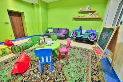 a childs play room with colorful furniture and a couch at Parkowy Dworek in Rabka