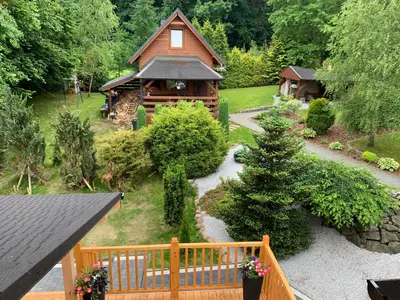 an aerial view of a log cabin in a garden at Dom na Leśnej in Po”łwieś