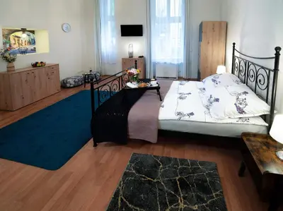 a bedroom with a bed and a blue rug at Czar Prowansji - Comfy & Quiet near Rynek&Train Station Netflix in Kraków