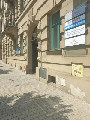 a building with a sign on the side of it at Czar Prowansji - Comfy & Quiet near Rynek&Train Station Netflix in Kraków