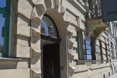 a building with a black door and an archway at Czar Prowansji - Comfy & Quiet near Rynek&Train Station Netflix in Kraków