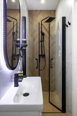 a bathroom with a shower and a white sink at Villa Gorczański Zakątek Agroturystyka in Konina