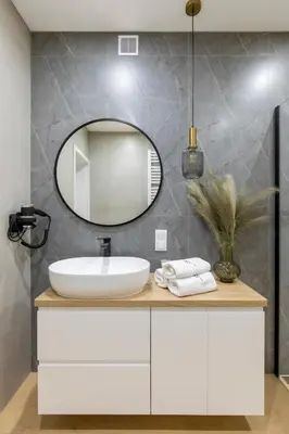 a bathroom with a sink and a mirror at Villa Gorczański Zakątek Agroturystyka in Konina