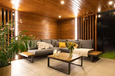 a living room with a couch and a table at Villa Gorczański Zakątek Agroturystyka in Konina