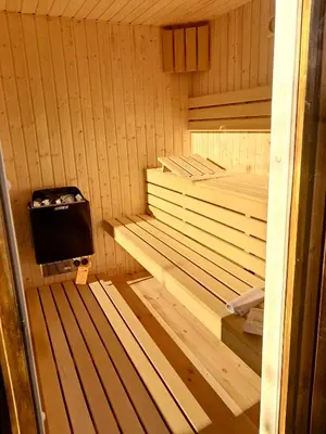 a inside of a sauna with a television in it at Villa Gorczański Zakątek Agroturystyka in Konina
