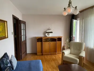a living room with a couch and a chair at Apartament Siewna-moje miejsce na idealne wakacje in Kraków
