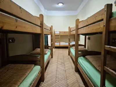 a group of bunk beds in a room at 50 People Apartment in Kraków