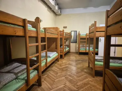 a group of bunk beds in a room at 50 People Apartment in Kraków