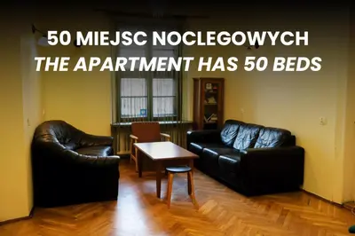 an empty hallway with a hallway leading into a room at 50 People Apartment in Kraków