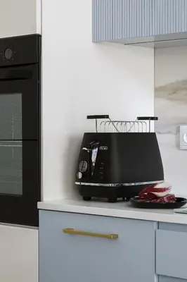 a kitchen with a microwave and a toaster oven at Flav Apartment in Kraków