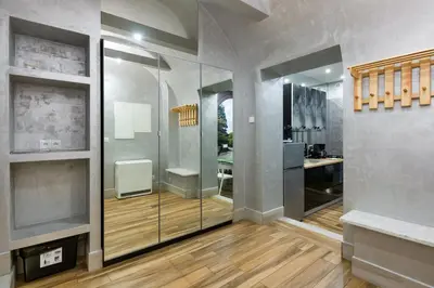 a bathroom with a glass shower with a sink at Mikolajska Residence in Kraków