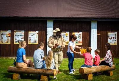 a living room with a mirror and a television at Miodowa Zagroda - nocleg Zator Energylandia in Miejsce