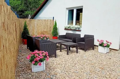 a living room with a couch and a table at Miodowa Zagroda - nocleg Zator Energylandia in Miejsce