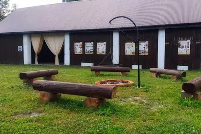 a living room with a table and a couch at Miodowa Zagroda - nocleg Zator Energylandia in Miejsce