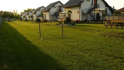 a yard with a group of houses in the background at Zator Lider House Energy in Zator