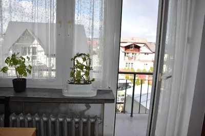 a window with a view of a building at Travel Apartament Cracow in Kraków