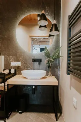a bathroom with a sink and a mirror at The View House Rabka-Zdrój WELLNESS & SPA in Rabka