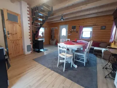 a dining room with a table and chairs at U Krysi in Kojszówka