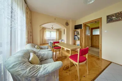 a living room with a table and chairs at Noclegi Obidowa-Pod Grapą in Obidowa