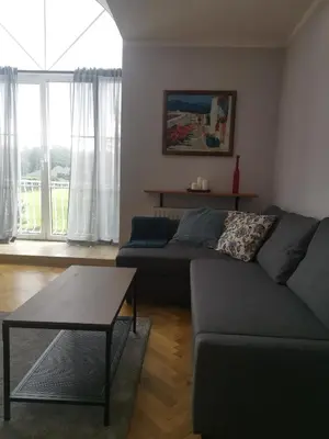 a living room with a couch and a table at SOSNOWA 23 in Tenczynek