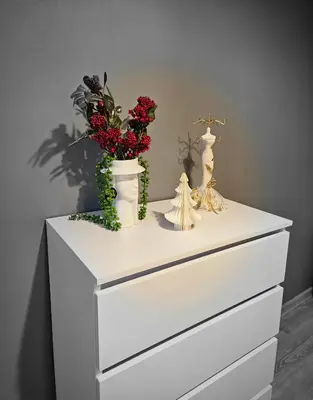 a white dresser with two vases and flowers on it at Sara -Mikołajska - Rynek - Netflix Hydromassage in Kraków