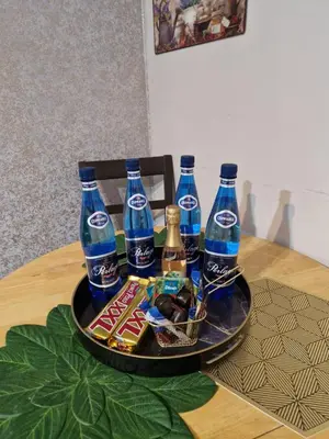 a tray with bottles of soda and snacks on a table at Sara -Mikołajska - Rynek - Netflix Hydromassage in Kraków