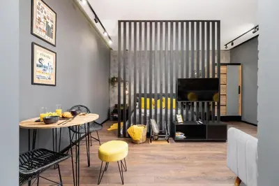 a living room with a table and a fireplace at Old Town Studio Good Vibes by Noclegi Renters in Kraków