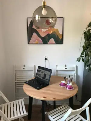 a living room with a couch and pictures on the wall at M37 x Fabryczna in Limanowa