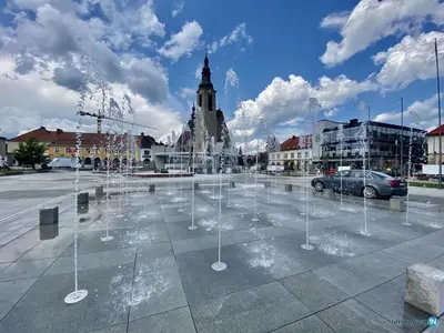 a water fountain in a parking lot in a city at M37 x Fabryczna in Limanowa