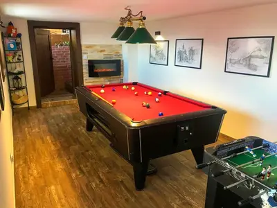 a room with a pool table with balls on it at apartament simonka z jacuzzi zawoja in Zawoja