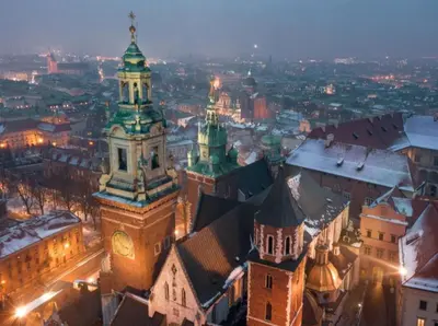 an aerial view of a city at night at Spa Bath Apartment in Kraków
