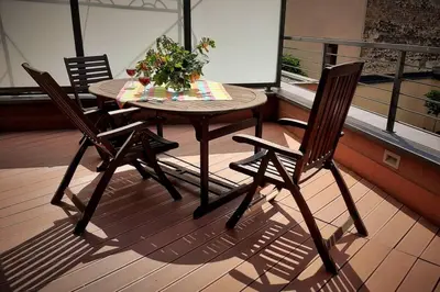 a table and two chairs on a balcony at Apartament z tarasem - Appartment with tarace in Kraków