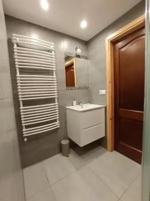 a bathroom with a sink and a mirror at Noclegi Leśniczówka w Lanckoronie in Lanckorona