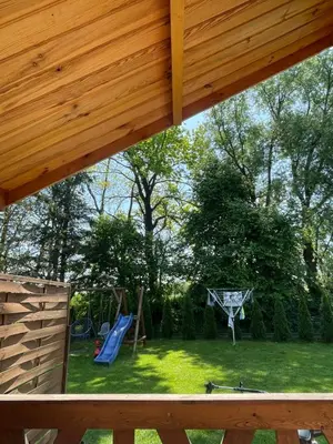 a view of a backyard with a playground at Chatka pod orzechem in Spytkowice