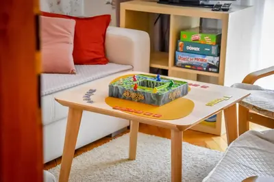 a table with a toy on top of it in a living room at Apartament w Alejce in Rabka