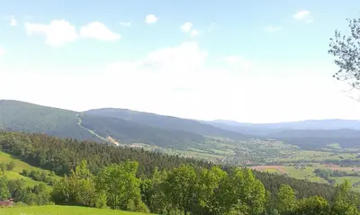 a view of a valley with trees and mountains at Dom Słoneczna Chata Kasina Wielka in Kasina Wielka