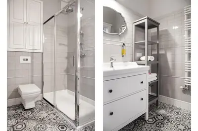 a bathroom with a shower and a sink and a toilet at HOUSEHOST Apartment :Zacisze Street in Kraków