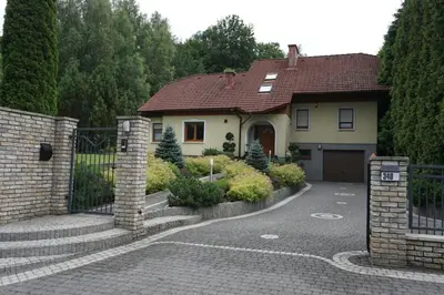 a house with a gate and a driveway at Villa Barwald in Barwałd Górny