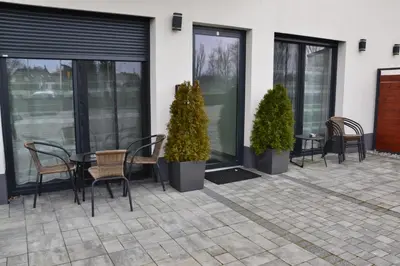 a living room with two beds and a couch at Apartamenty na Ceglanej in Oświęcim