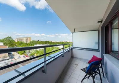 a balcony with a view of a city at P&P Apartments in Kraków