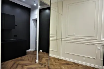a dressing room with a mirror and a tv at Luxury Jacuzzi Apartment in Kraków