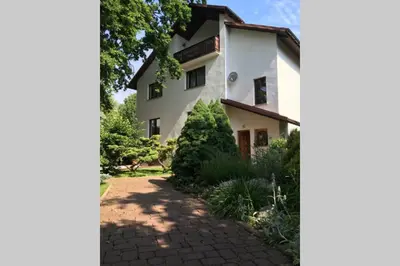 an external view of the house from the driveway at Hidden Gem Garden in Kraków