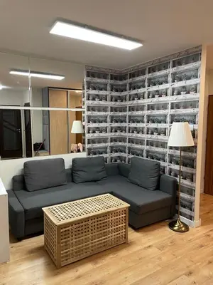 a living room with a couch and a table at Apartament Podłęska in Kraków