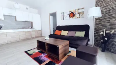 a living room with a couch and a table at Piłsudskiego 11 by Homeprime in Kraków