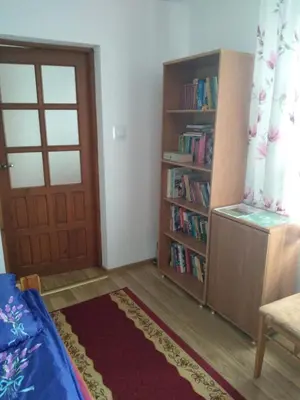a room with a door and a book shelf at Siedlisko Pauza in Kozłów