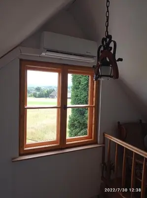 a window in a room with a view of a field at Gospodarstwo Agroturystyczne U Stasików in Spytkowice