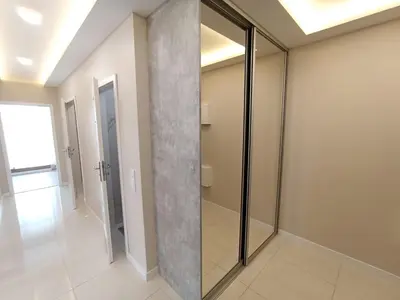 a walk in shower in a room with a glass door at APARTAMENTY BARSKA 69 in Kraków