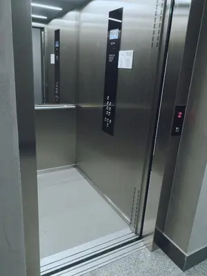 a stainless steel refrigerator in a elevator in a building at Apartament Źródełko in Bochnia