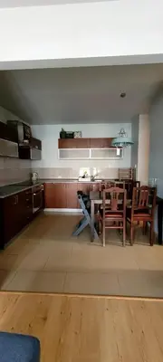 a kitchen and dining room with a table and chairs at Miło powitać Cię w Krakowie. in Kraków