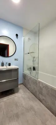 a bathroom with a shower and a sink and a mirror at Miło powitać Cię w Krakowie. in Kraków